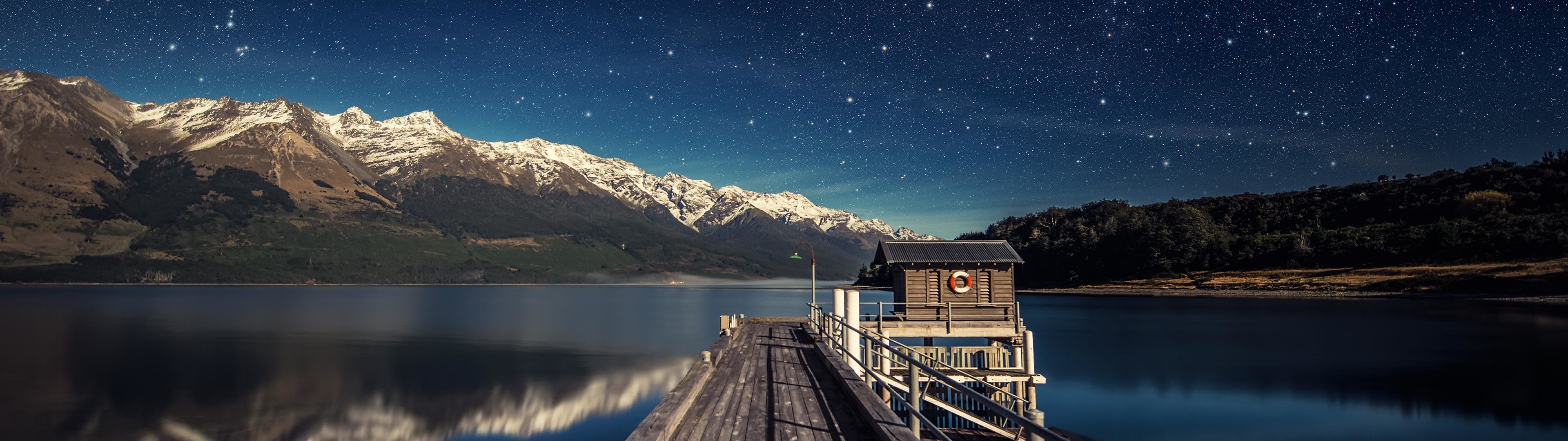 Lago Wakatipu, Nuova Zelanda, Molo, Montagne innevate, Notte stellata, sfondo ultrawide 32:9